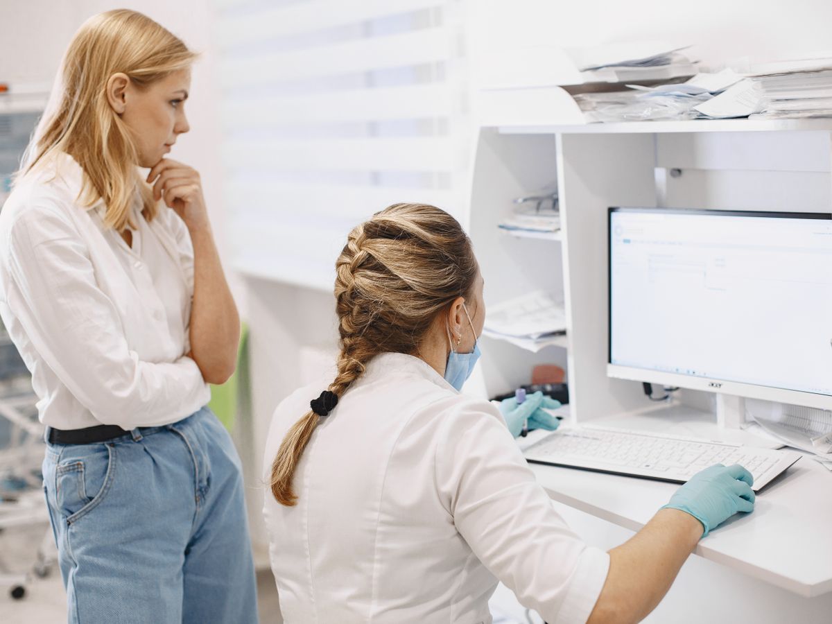 Clinical research team reviewing study data on the AIClinTrack platform
